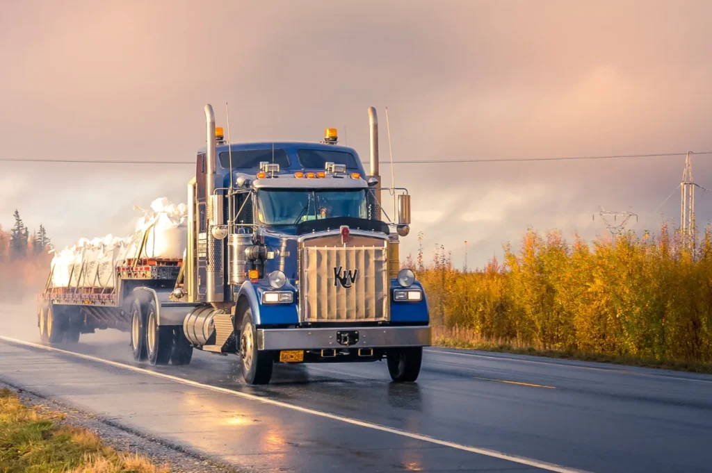 Commercial truck driving down the highway.