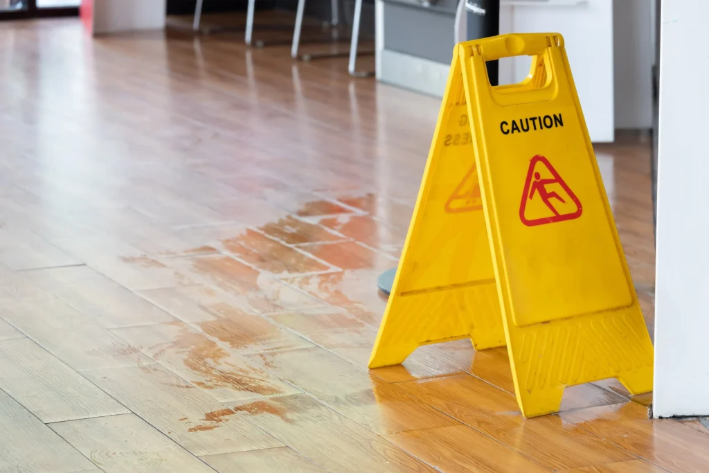 Wet floor sign and water on the floor.